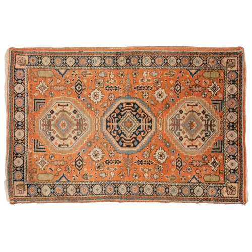 333 - An old possibly North West Persian tribal rug with two lozenges on a faded ivory ground, 165 cm x 90... 