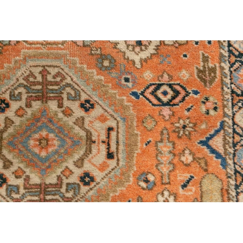 333 - An old possibly North West Persian tribal rug with two lozenges on a faded ivory ground, 165 cm x 90... 