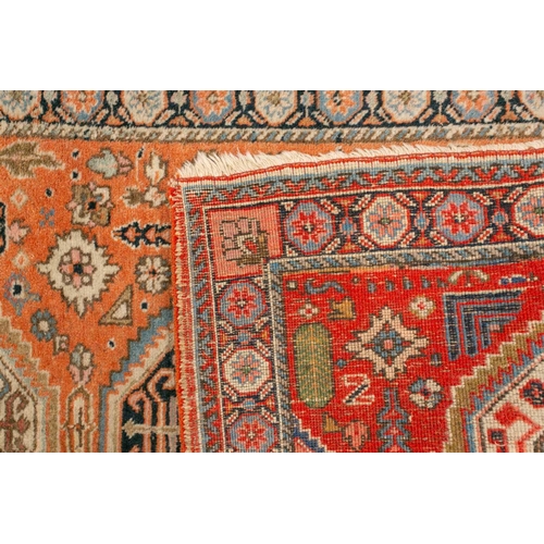 333 - An old possibly North West Persian tribal rug with two lozenges on a faded ivory ground, 165 cm x 90... 