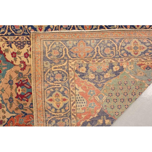 337 - An old probably Kerman rug with an all-over mandorla-shaped tile ground filled with flower heads and... 