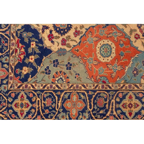 337 - An old probably Kerman rug with an all-over mandorla-shaped tile ground filled with flower heads and... 