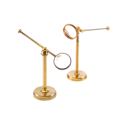 359 - Two lacquered brass bullseye condenser lenses, each with 1¾ inch lens and adjustable arms and stem (... 