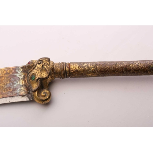 375 - An Indian Bhuj (elephant axe), India Kutch, late 19th century with a gilt copper haft and scabbard a... 