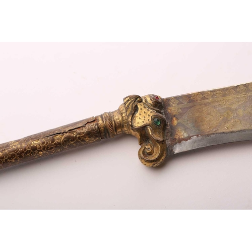 375 - An Indian Bhuj (elephant axe), India Kutch, late 19th century with a gilt copper haft and scabbard a... 