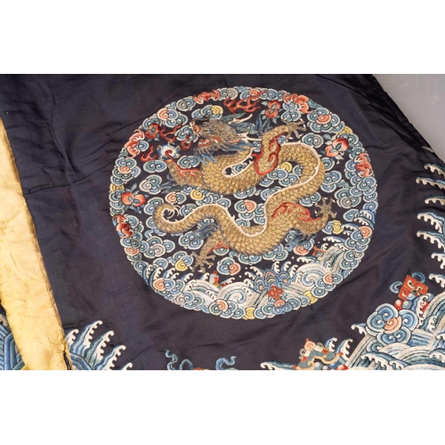 379 - A Chinese cobalt blue silk courtiers waistcoat(?) with six bullion embroidered Imperial dragon round... 