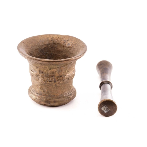 380 - A bronze pestle and mortar, the mortar with collared tapering sides, 15 cm high 17.5 cm diameter, th... 