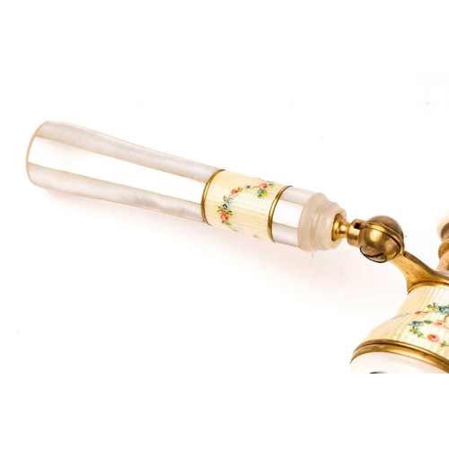 390 - A pair of gilt metal and enamel opera glasses with mother of pearl detail and a pair of gilt metal f... 