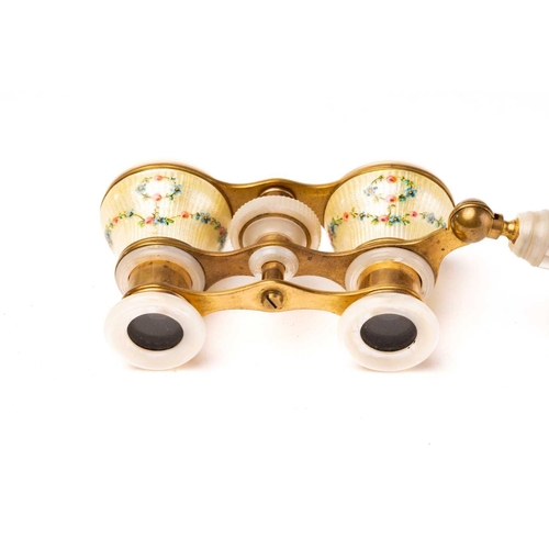 390 - A pair of gilt metal and enamel opera glasses with mother of pearl detail and a pair of gilt metal f... 