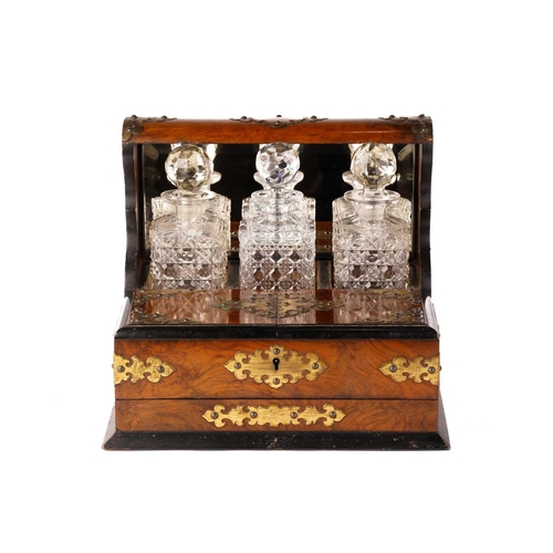 395 - A Victorian walnut and gilt-metal mounted three decanter tantalus and games compendium, the square d... 