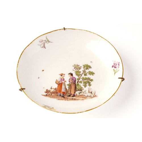 401 - A Meissen porcelain saucer, depicting couple in conversation beside sheep and a bull, cross swords m... 