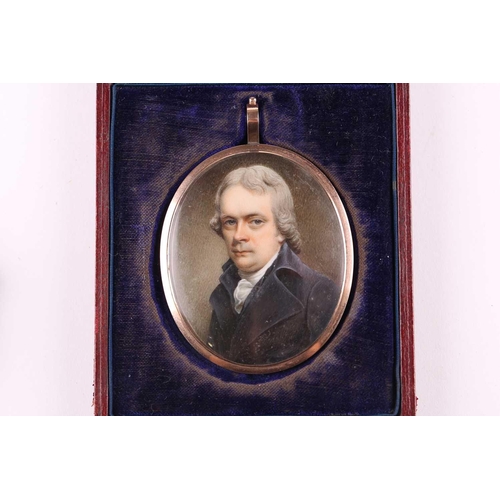 425 - An early 19th-century oval portrait miniature on an ivory panel depicting a bust-length likeness of ... 