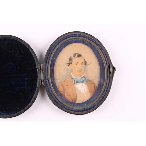 425 - An early 19th-century oval portrait miniature on an ivory panel depicting a bust-length likeness of ... 