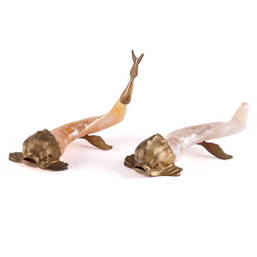 428 - A pair of mother of pearl and brass figures of mythical dolphins, each signed Shirley Addis, 24 cm h... 