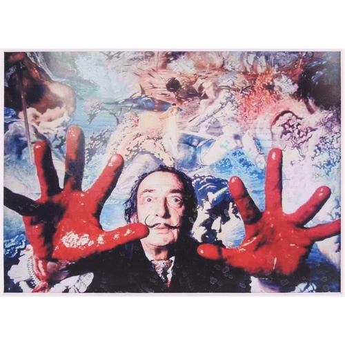 96 - A Salvador Dali signed menu and photo, mounted with two additional images of Salvador Dali (one indi... 