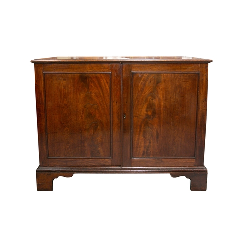 263 - A George III probably North Country figured mahogany two-door low cupboard each door with an astraga... 