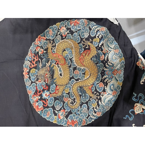 379 - A Chinese cobalt blue silk courtiers waistcoat(?) with six bullion embroidered Imperial dragon round... 