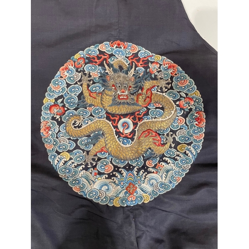 379 - A Chinese cobalt blue silk courtiers waistcoat(?) with six bullion embroidered Imperial dragon round... 