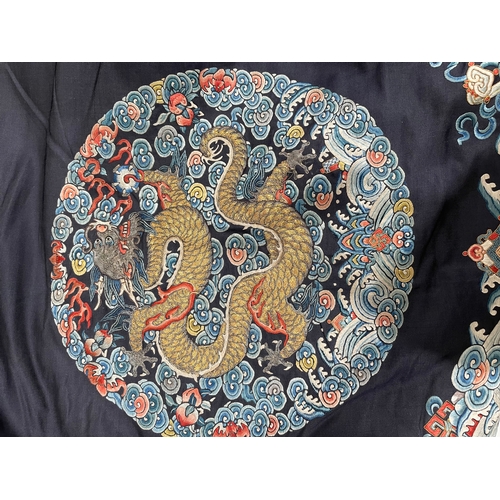 379 - A Chinese cobalt blue silk courtiers waistcoat(?) with six bullion embroidered Imperial dragon round... 