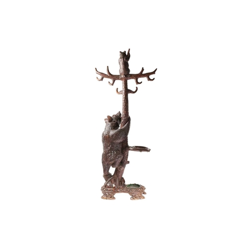 1 - A large late 19th-century carved wood Black Forest Bear hall stand; modelled as a bear cub seated at... 