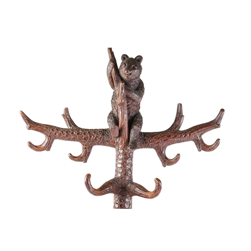 1 - A large late 19th-century carved wood Black Forest Bear hall stand; modelled as a bear cub seated at... 