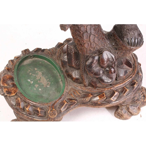 1 - A large late 19th-century carved wood Black Forest Bear hall stand; modelled as a bear cub seated at... 