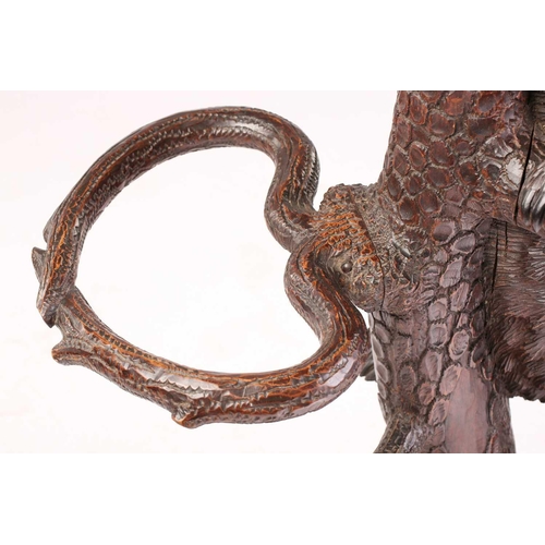 1 - A large late 19th-century carved wood Black Forest Bear hall stand; modelled as a bear cub seated at... 