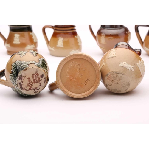 58 - Twenty Doulton stoneware miniature harvest jugs, twelve of them having silver rims, largest 4.5cm hi... 