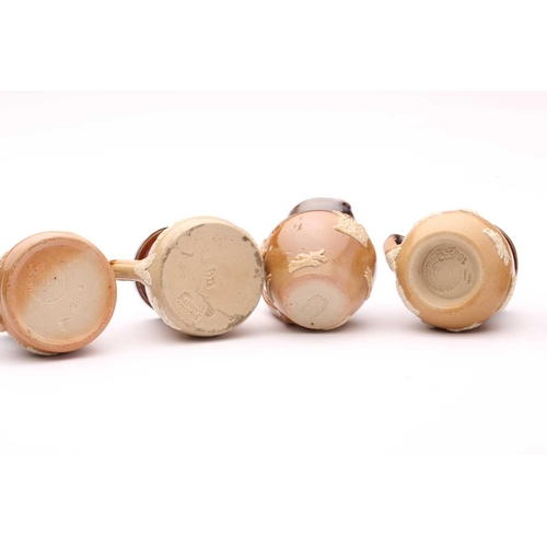 58 - Twenty Doulton stoneware miniature harvest jugs, twelve of them having silver rims, largest 4.5cm hi... 