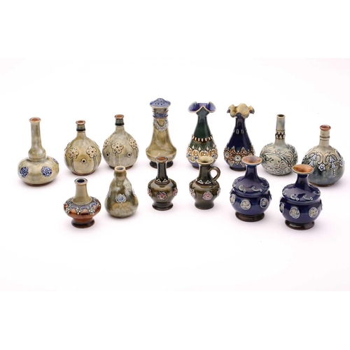 76 - A collection of fourteen Doulton stoneware miniature vases, jug and pepperette, largest 10.5cm highQ... 