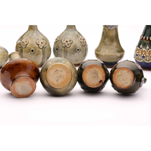 76 - A collection of fourteen Doulton stoneware miniature vases, jug and pepperette, largest 10.5cm highQ... 