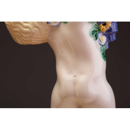 79 - Michael Powolny (1871-1954) Austrian, a pair of ceramic candlesticks, modelled as putti supporting a... 