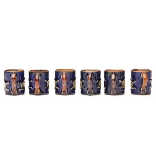 81 - Six Royal Doulton stoneware Lord Nelson commemorative miniature mugs, circa 1905, olive green portra... 