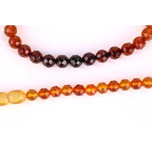 115 - A set of two amber bead bracelets and two amber bead necklaces (with sunspangles), featuring faceted... 