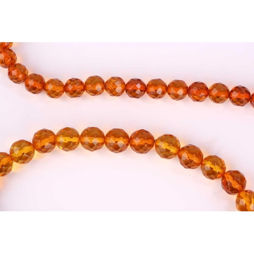 115 - A set of two amber bead bracelets and two amber bead necklaces (with sunspangles), featuring faceted... 