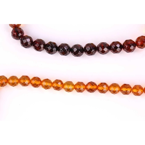 115 - A set of two amber bead bracelets and two amber bead necklaces (with sunspangles), featuring faceted... 