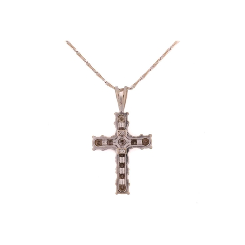 120 - A diamond set cross; comprising eleven slightly graduated round brilliant cut diamonds in claw mount... 