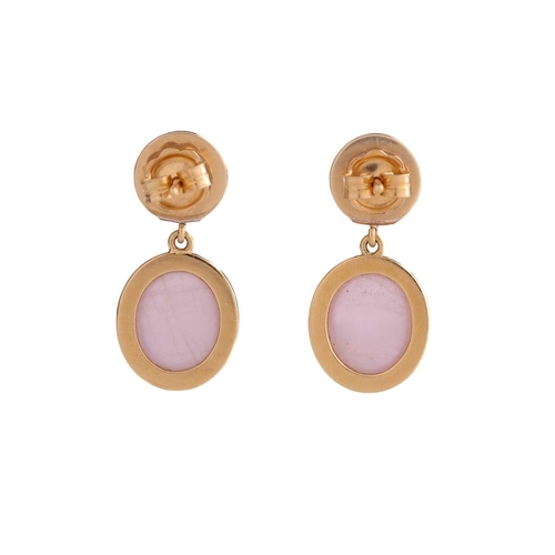 125 - A pair of rose quartz drop earrings, each comprises a larger oval rose quartz cabochon in collet set... 