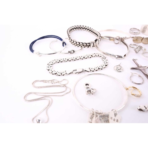 13 - A lot consisting of assorted white metal jewellery, to include a silver open bangle, engraved with g... 