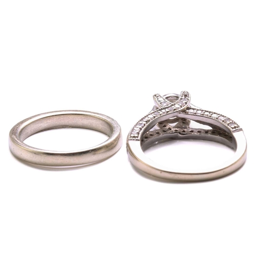 137 - A diamond trellis engagement ring and a fitted enhancer guard; The engagement ring forms from one ce... 