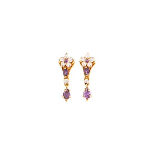 142 - Three pairs of gem-set earrings in high carat; to include a pair of earrings set with white and purp... 