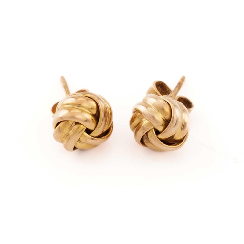 143 - A pair of ear studs in 9ct yellow gold, of twist knot form, fitted with peg and butterflies, London ... 