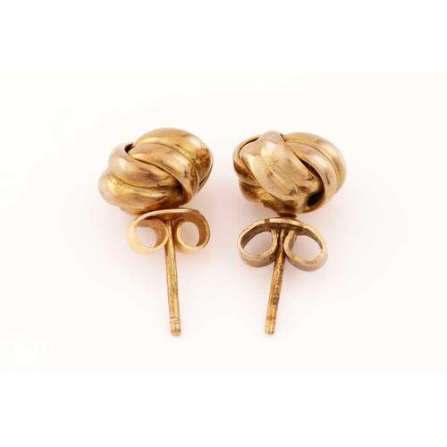 143 - A pair of ear studs in 9ct yellow gold, of twist knot form, fitted with peg and butterflies, London ... 