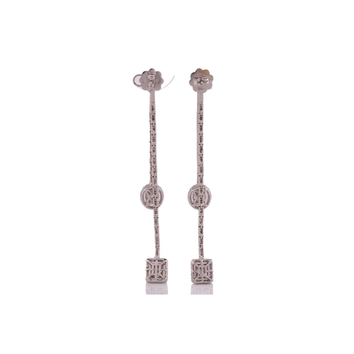 144 - A pair of 18 carat white gold and diamond metamorphic pendant earrings; each comprising an oval and ... 