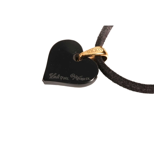 149 - Lalique - a black 'Amoureuse Beaucoup' heart pendant, with a yellow coloured gilt metal bale on an u... 