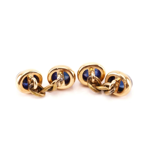 151 - A French dress set with sapphires, comprises oval high dome sapphire cabochons in yellow precious me... 