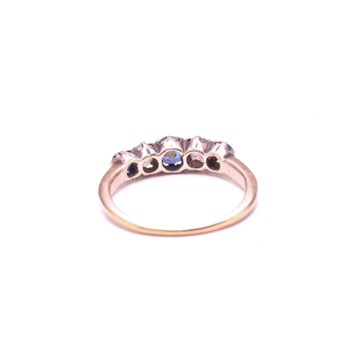 155 - A Sapphire and old-cut Diamond five-stone ring, set with a central round Sapphire flanked by two old... 