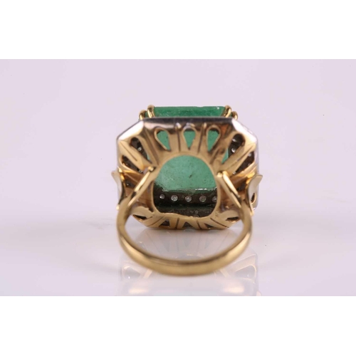 159 - An emerald and diamond cluster ring, featuring a step-cut emerald with a translucent light green-col... 