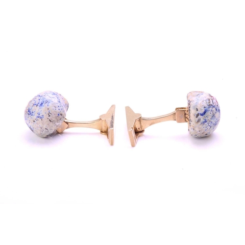 167 - A pair of enamelled skull cufflinks, each comprising a multi-coloured enamelled silver hollow skull,... 