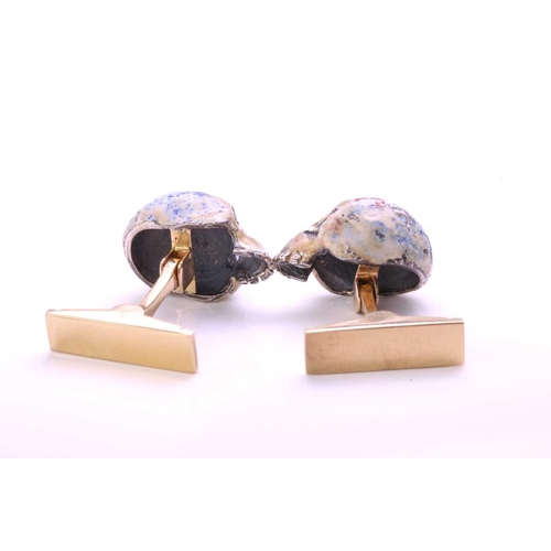 167 - A pair of enamelled skull cufflinks, each comprising a multi-coloured enamelled silver hollow skull,... 