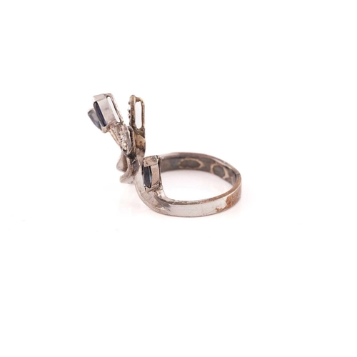 173 - A sapphire and diamond spray ring; the crossover mount with five strands, three terminating in marqu... 